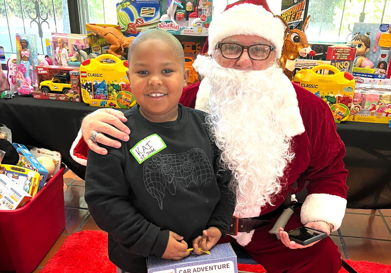 SANTA delivering gifts to system impacted kids
